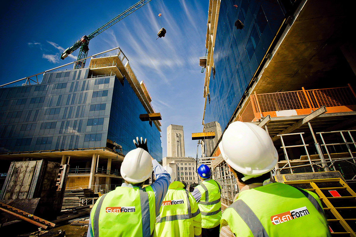 Glenform Construction Ltd. workforce on building site wearing branded high vis vests.